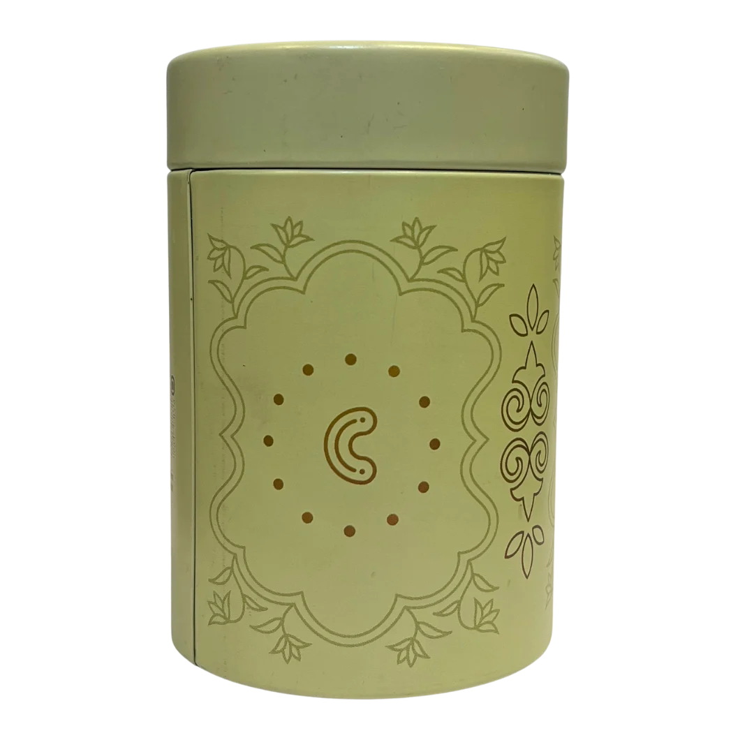 Green cylindrical container with Cashew flavour decorative design on a white background