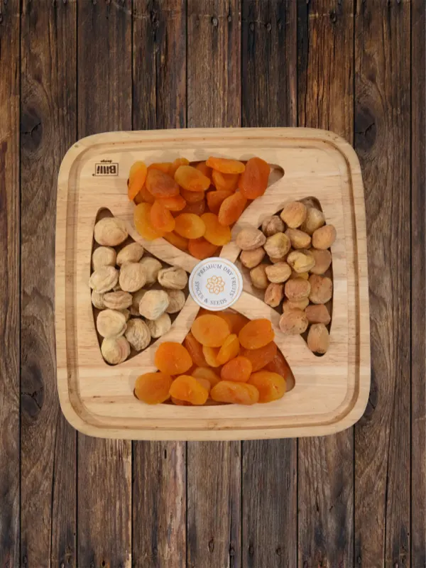 Assorted premium apricots and jardalu displayed on wooden tray by House of Rasda.