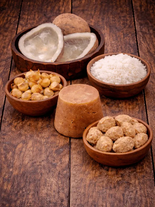 Kashmiri garlic, dry coconut, desiccated coconut, soya chunks and jaggery on wooden background