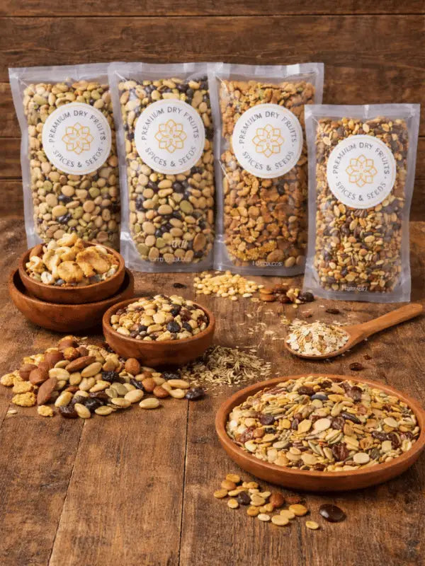 Premium trail mix and dry fruits collection displayed in wooden bowls and resealable packs on rustic wooden background – includes nut mixes, seed blends, muesli and healthy snacks by House of Rasda