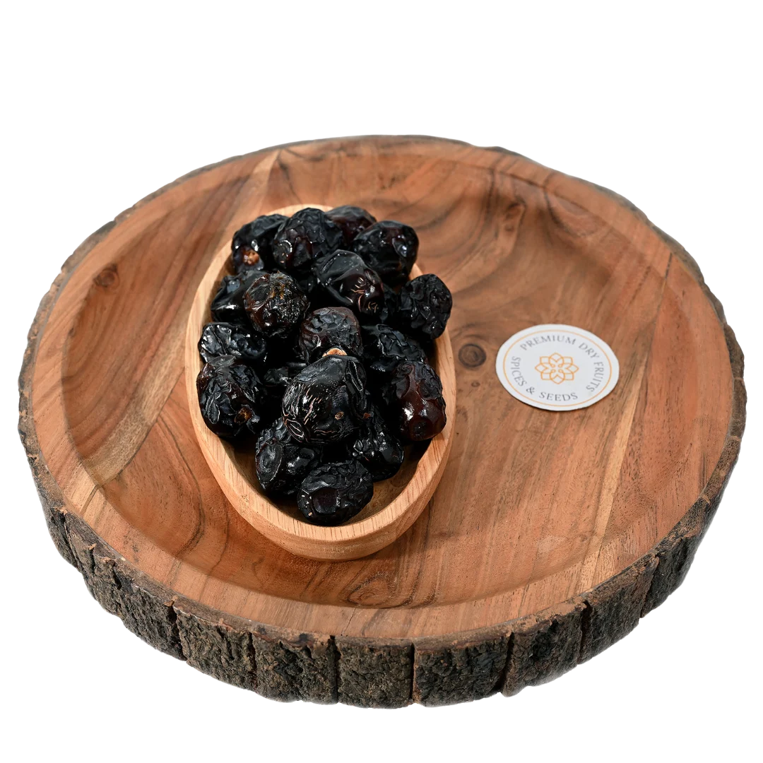Premium Ajwa Dates Saudi Arabia in wooden bowl soft sweet natural dates rich in fiber and energy