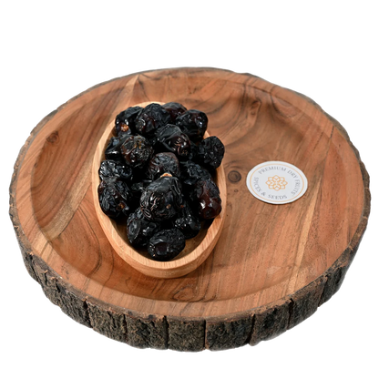 Premium Ajwa Dates Saudi Arabia in wooden bowl soft sweet natural dates rich in fiber and energy