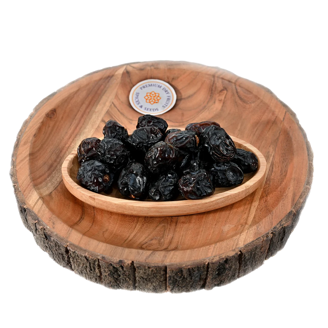 Saudi Premium Ajwa Dates served in wooden bowl soft chewy dates rich in antioxidants and minerals