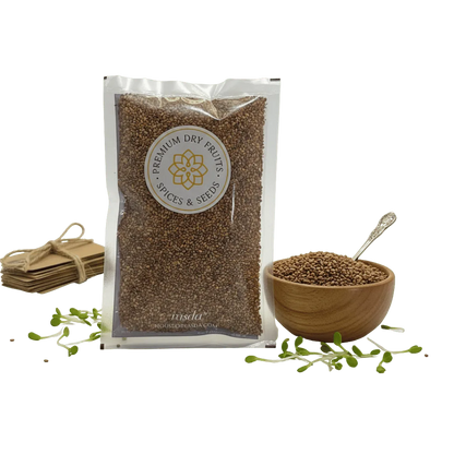 Packaged Alfalfa Seeds with a bowl and spoon on a white background