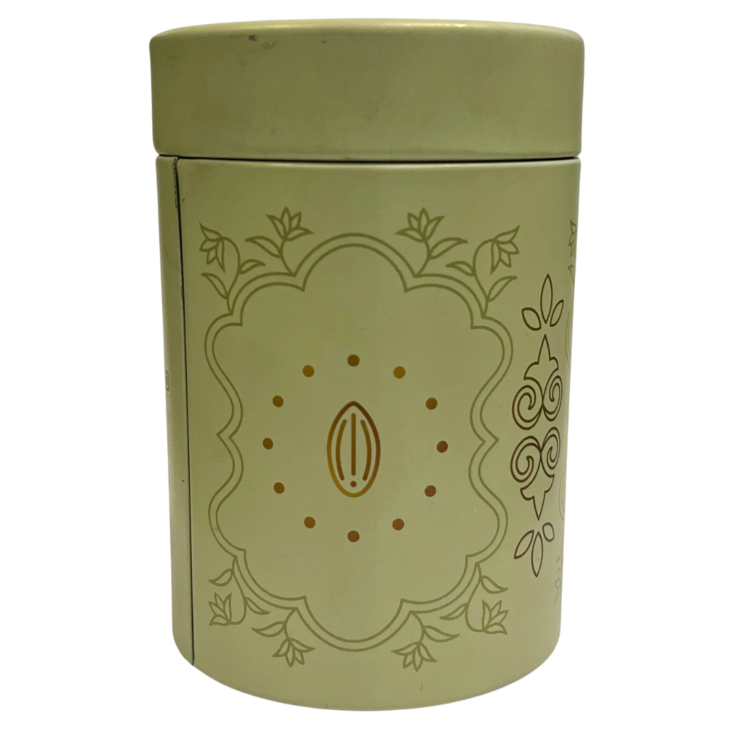 Green cylindrical container with decorative design on a white background 