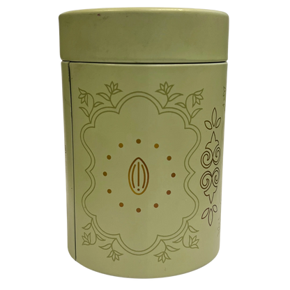 Green cylindrical container with decorative design on a white background 