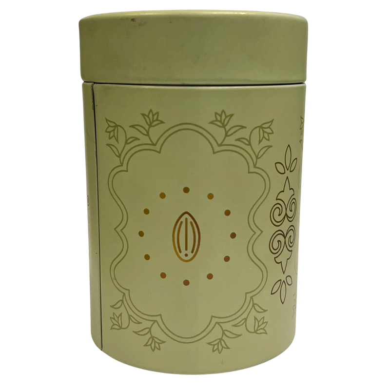 Green cylindrical container with decorative design on a white background 