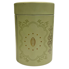 Green cylindrical container with decorative design on a white background 