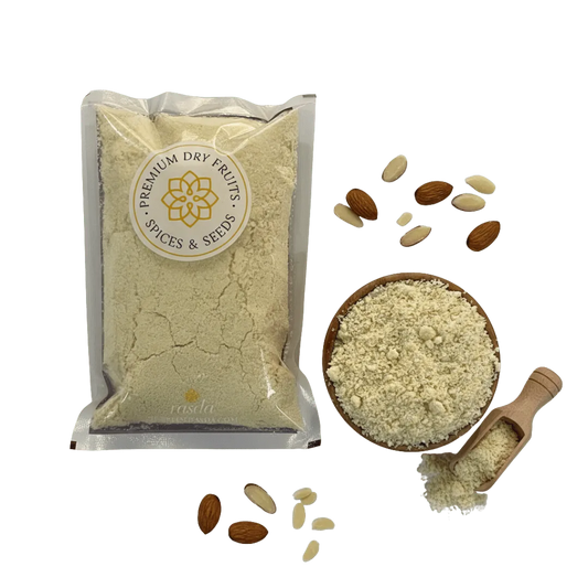Packaged premium Blanched Almond Flour and spices with a bowl of ground powder and almonds on a white background.