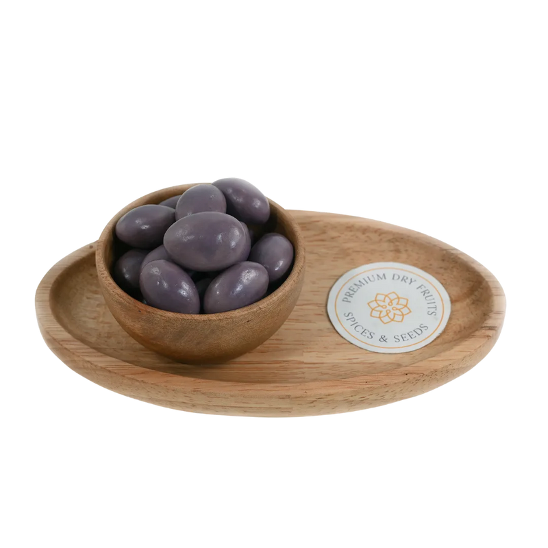 Almonds Blueberry Chocolate Coated Badam in wooden bowl – roasted almonds covered in creamy blueberry chocolate for delicious healthy snacking