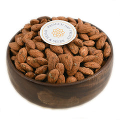Almonds Chilly Garlic Spiced, also known as Badam, is a savory and spicy snack made from roasted almonds combined with garlic and chili seasoning.