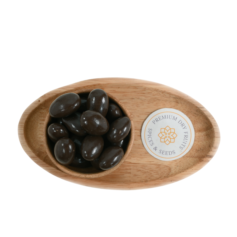 Artistic arrangement of Almonds Chocolate Coated in a wooden bowl, emphasizing the decadent chocolate layer enveloping each almond.