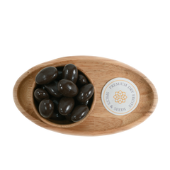 Artistic arrangement of Almonds Chocolate Coated in a wooden bowl, emphasizing the decadent chocolate layer enveloping each almond.