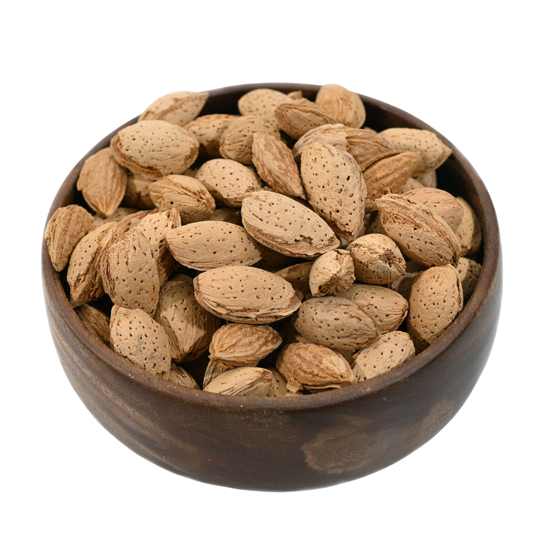 Close-up of Inshelled almonds in a wooden bowl, showcasing their rough surface and organic appeal.