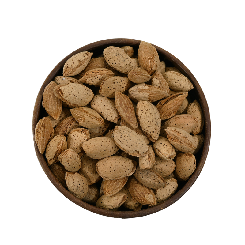 A wooden bowl filled with crunchy in-shell almonds, perfect for traditional snacking or festive platters.