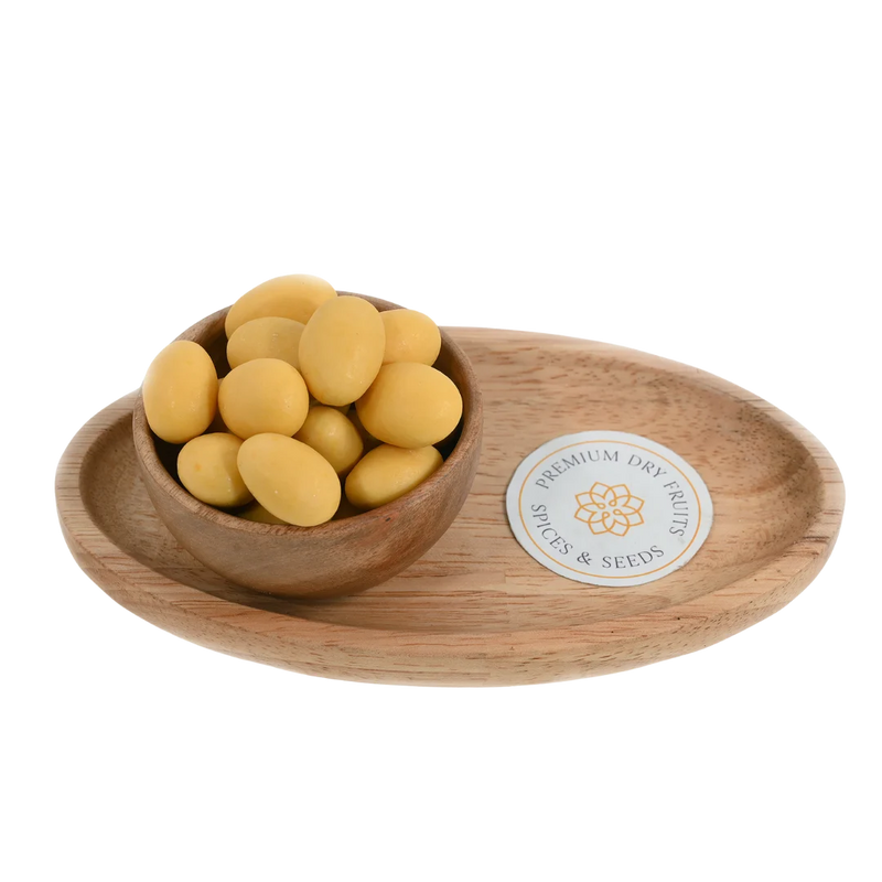 Almonds Mango Chocolate Coated Badam in wooden bowl – roasted almonds covered in smooth mango flavored chocolate for fruity healthy snacking