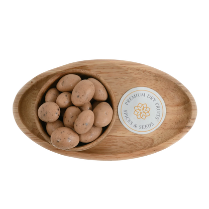 Oreo Chocolate Coated Almonds Badam close up – delicious dry fruits dipped in creamy chocolate and oreo mix perfect for