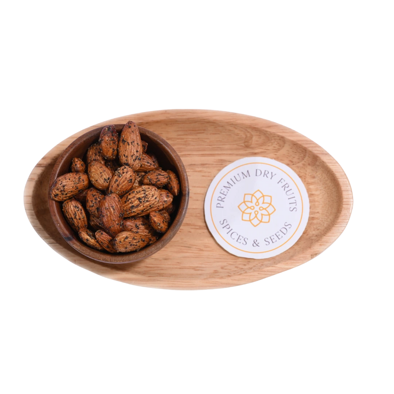 Wooden bowl with Almonds Pepper Spiced on a wooden tray, featuring a 'Spices & Seeds' label.