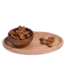 Wooden bowl and tray with Almonds Pepper Spiced on a white background