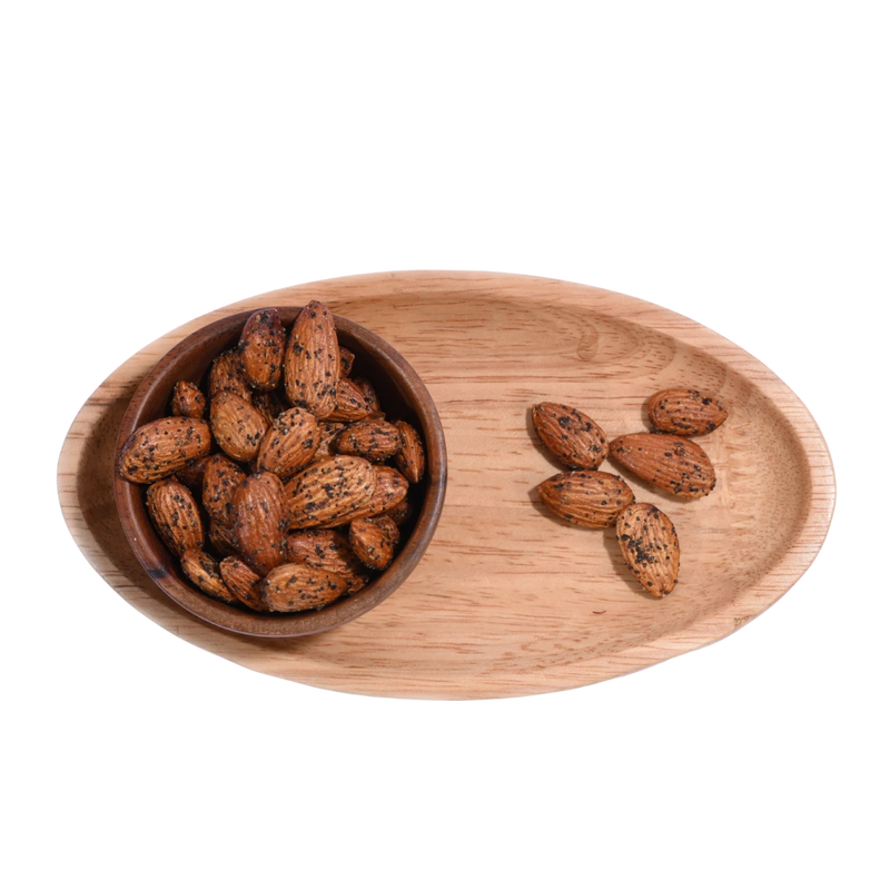Wooden bowl and tray with Almonds Pepper Spiced on a white background