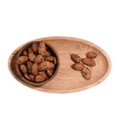 Wooden bowl and tray with Almonds Pepper Spiced on a white background