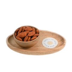 Wooden bowl with Almonds Peri Peri Spiced on a wooden tray with a visible brand label on a white background
