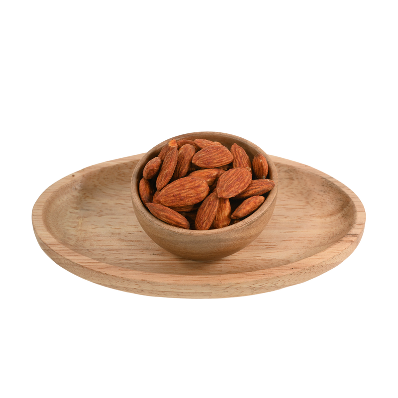 A handful of Almonds Peri Peri Spiced spread out on a slate background, highlighting the vibrant, bold peri peri seasoning.