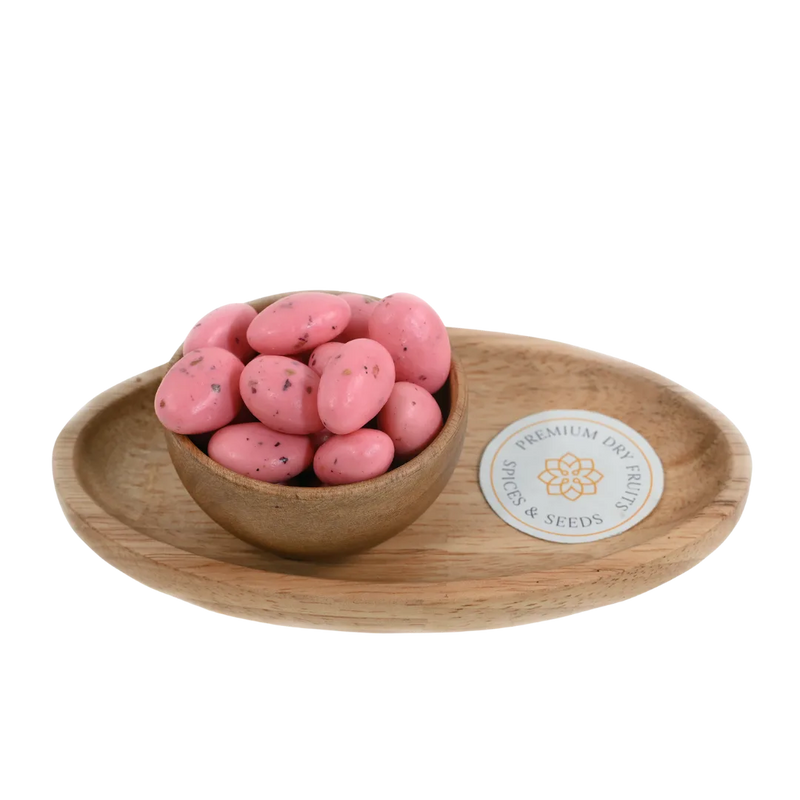 Almonds Rose Petal Chocolate Coated Badam in wooden bowl – roasted almonds coated in rose flavored chocolate blended with rose petals for aromatic sweet snacking