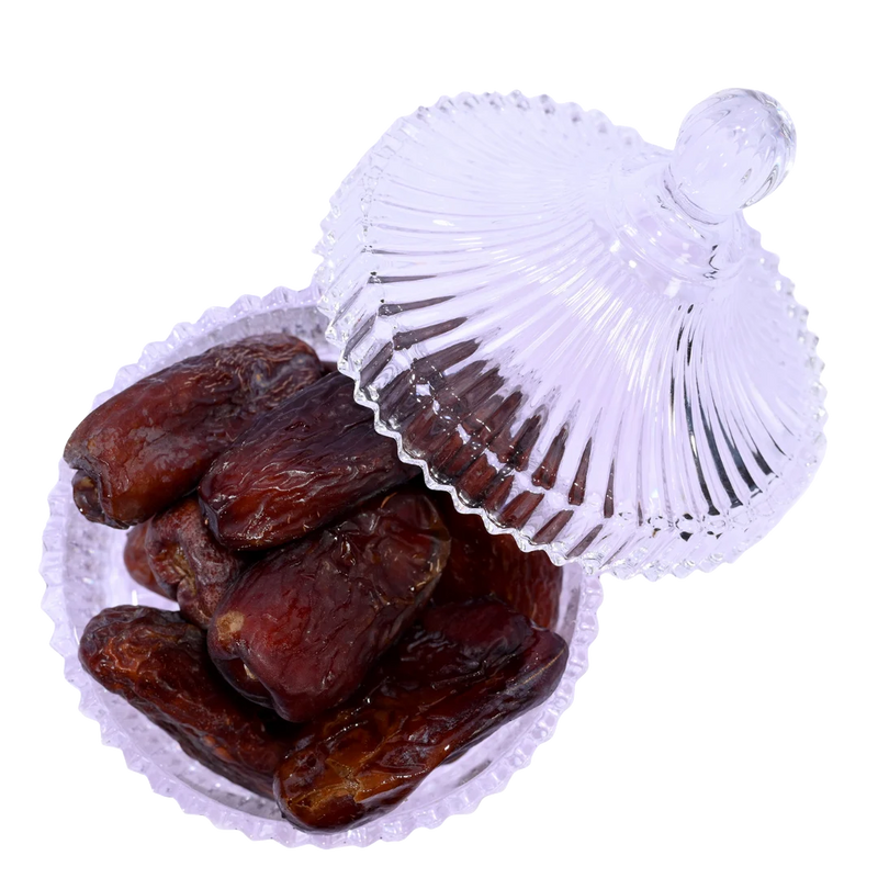 Premium Amber Dates from Saudi Arabia displayed in elegant glass bowl – healthy dry fruit rich in fiber and minerals