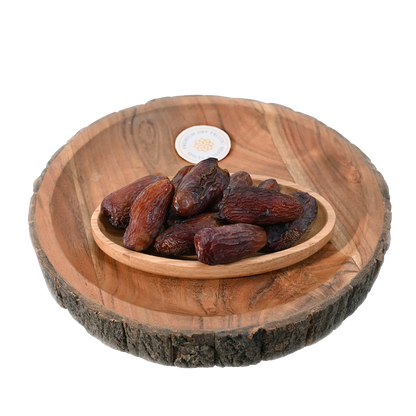 Amber Dates Saudi Arabia Premium in wooden bowl – handpicked Arabian dates rich in taste and nutrition