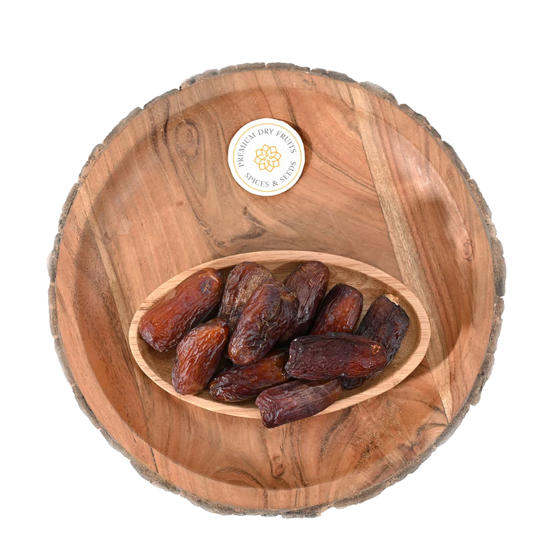 Premium Amber Dates Saudi Arabia in rustic wooden bowl – natural energy booster and immunity enhancer