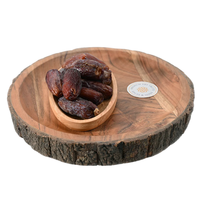 Amber Dates Saudi Arabia Premium quality dry fruits in wooden bowl – soft, chewy, and nutrient-rich dates