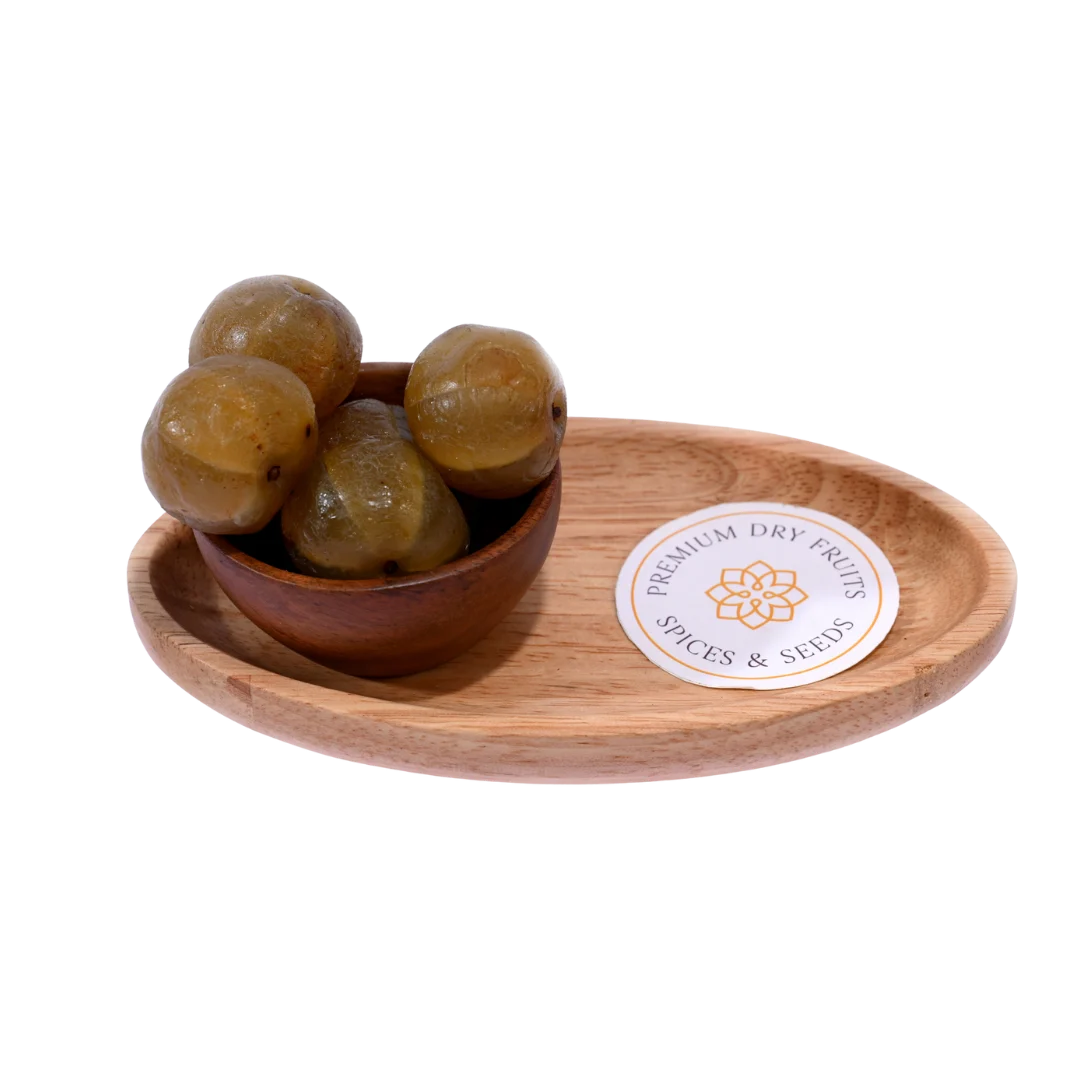 Bowl of Amla Honey Dried placed on a wooden background, showcasing its natural look.
