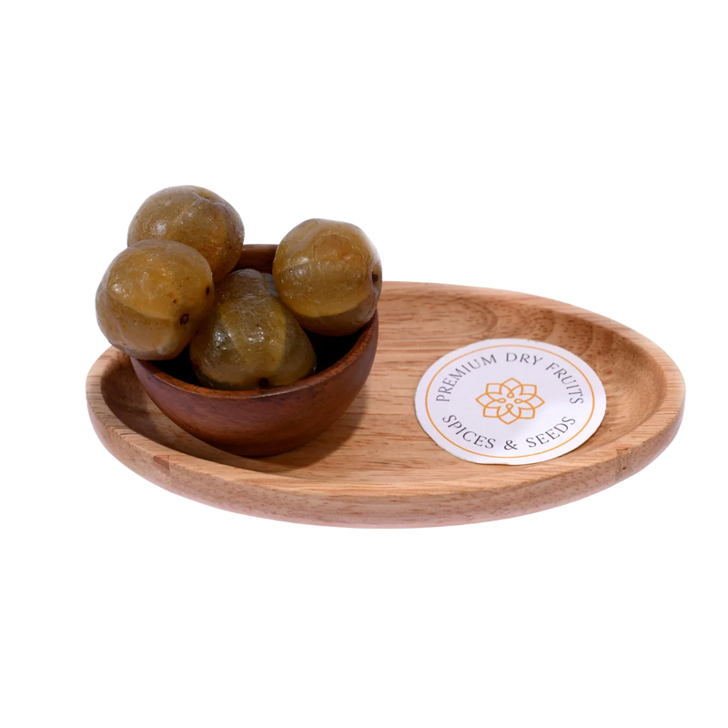Bowl of Amla Honey Dried placed on a wooden background, showcasing its natural look.