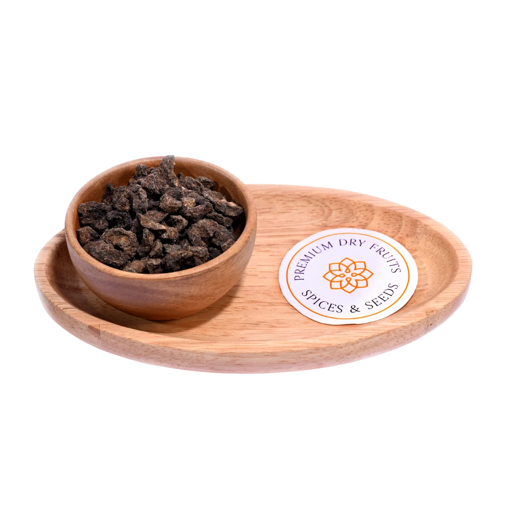 Rustic bowl filled with Amla Salted Dried placed on a wooden table