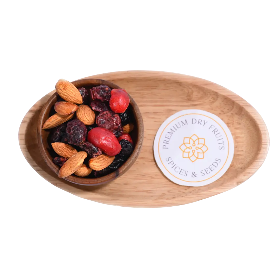 Antioxidant Trail Mix Wooden bowl with almonds and dried fruits on a wooden tray with a label.