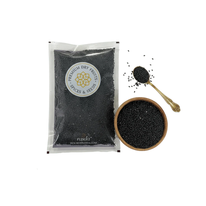 Basil Seeds in a transparent packaging with a branded label, next to a wooden bowl and spoon filled with seeds on a white background.