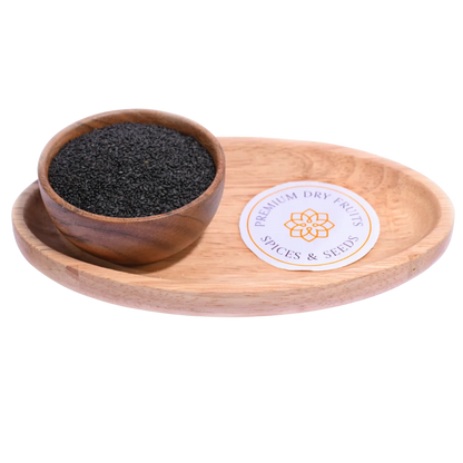 Tiny black Basil Seeds / Sabja Seeds displayed in a wooden bowl, highlighting their glossy surface and natural texture.