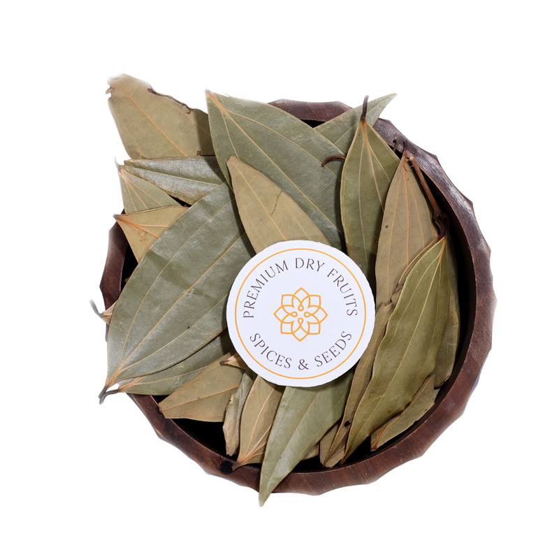 A bowl filled with dried bay leaves, sold by House of Rasda.