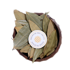 A bowl filled with dried bay leaves, sold by House of Rasda.