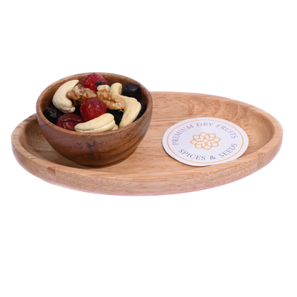 Wooden bowl with dried fruits and nuts  Berry Nutty Trail Mix on a matching wooden tray