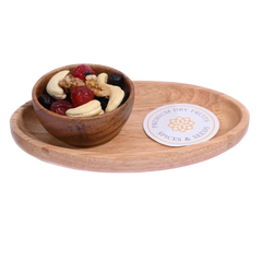 Wooden bowl with dried fruits and nuts  Berry Nutty Trail Mix on a matching wooden tray