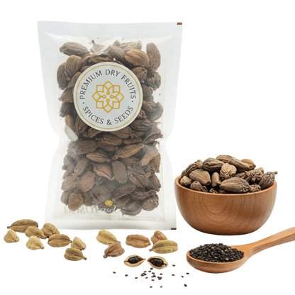 Packaged Black Cardamom with a bowl and spoon on a white background.