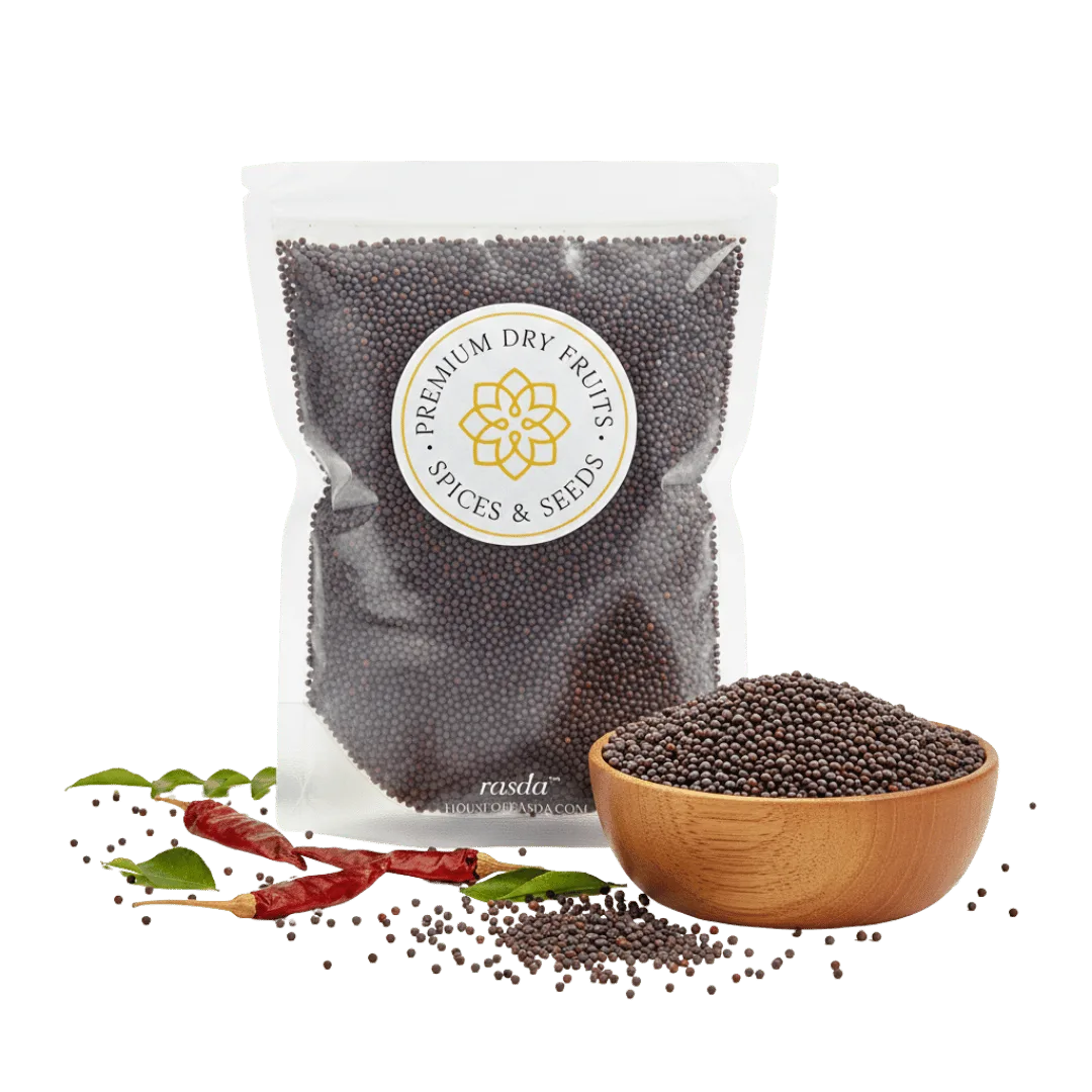 Packaged black mustard seeds with a bowl of seeds and dried red chilies on a white background.