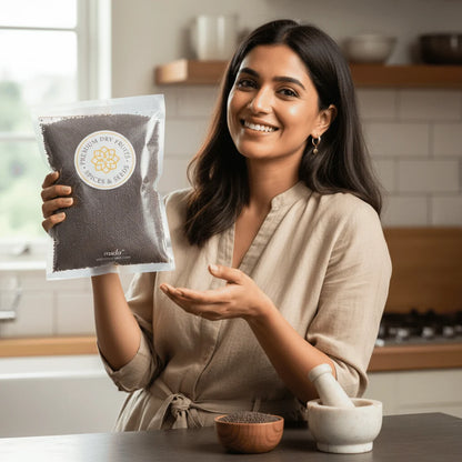 Woman holding a package of Black Mustard Seeds in a kitchen