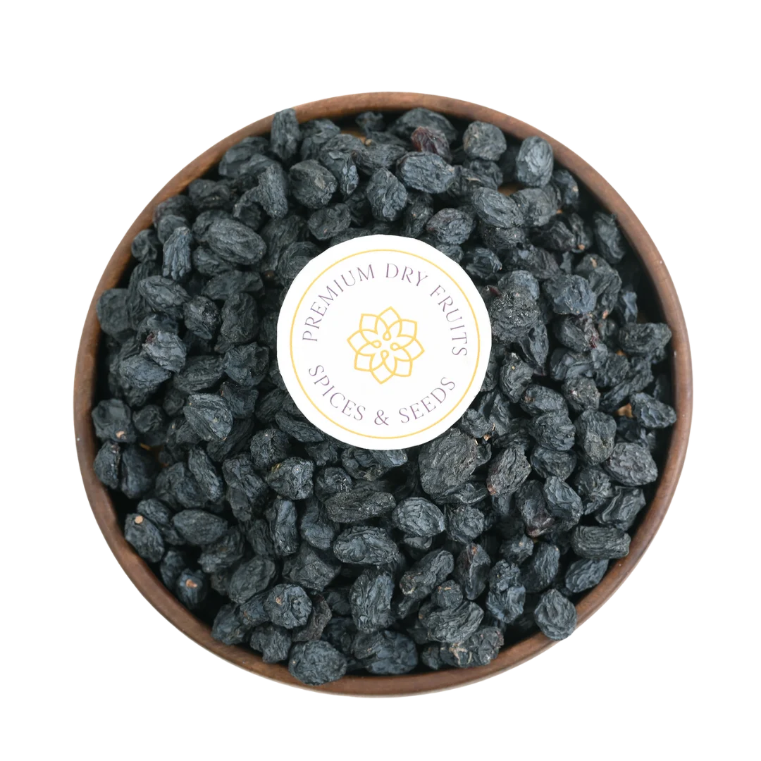 Premium Seedless Black Raisins or Kismis in Wooden Bowl – Fresh Soft Dry Fruit Packed with Nutrition and Energy