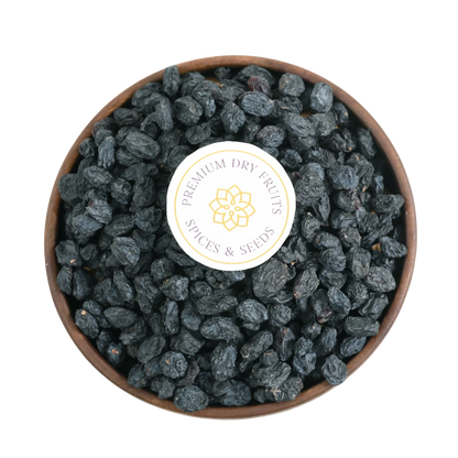Premium Seedless Black Raisins or Kismis in Wooden Bowl – Fresh Soft Dry Fruit Packed with Nutrition and Energy