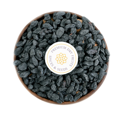 Premium Black Raisins with Seeds or Kismis in Wooden Bowl – Healthy Energy-Boosting Snack Packed with Nutrients