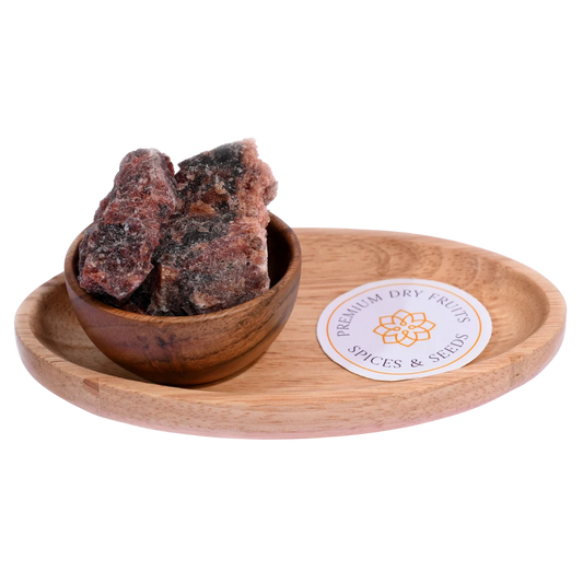 Black rock or salt kaala namak in wooden bowl natural mineral salt for cooking