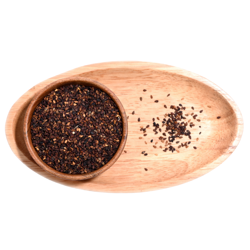 Black sesame seeds sprinkled over a salad, adding contrast and texture.